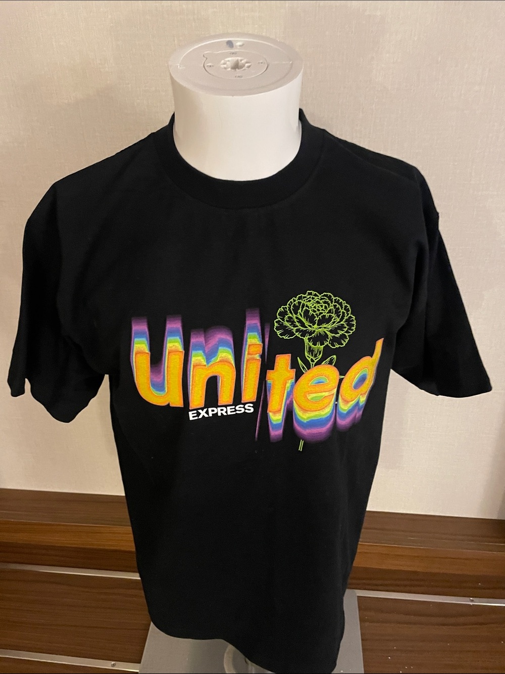 Express Black Tee with Multicolor 'United' Graphic and Green Floral Accent